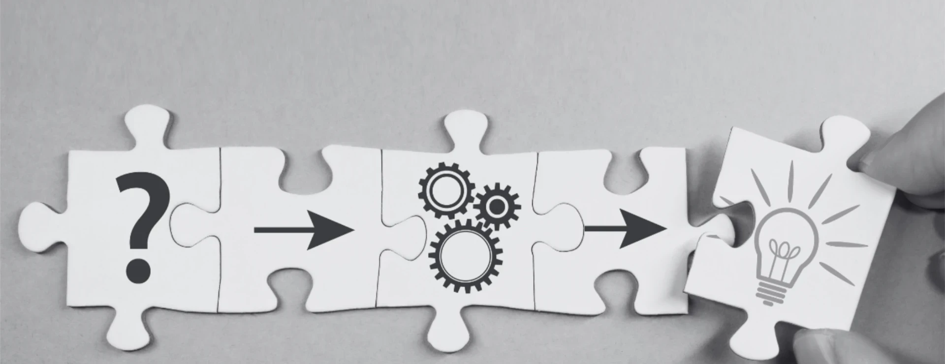 investigations hand moving puzzle pieces